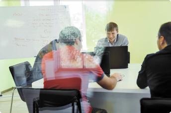 Team discussion at the whiteboard in a Semalt meeting room